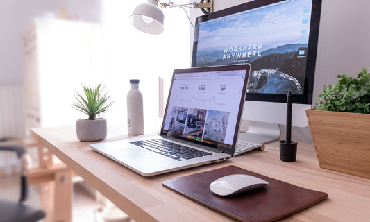 Minimal workspace with leather desk pad, notebook, and organized accessories by HappyPatina