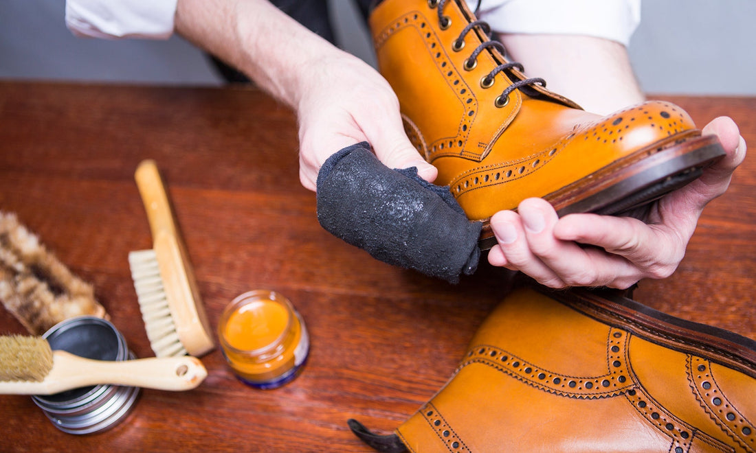 Leather shoes on cotton cloth with care products and soft light by HappyPatina