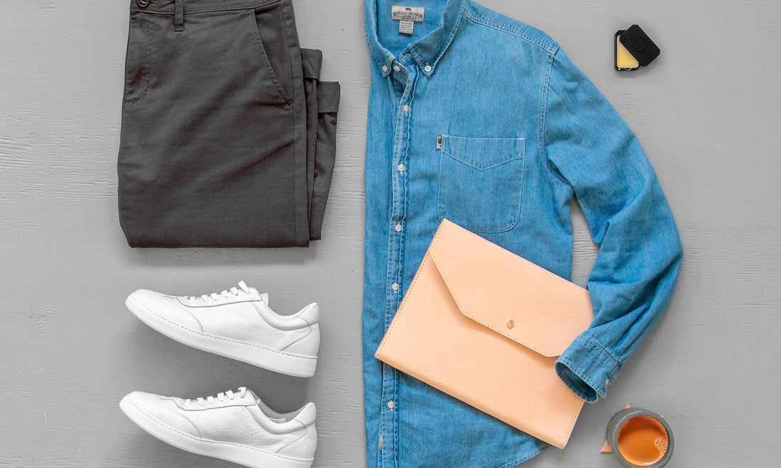 Leather travel essentials including folio, wallet, and key fob on linen background by HappyPatina