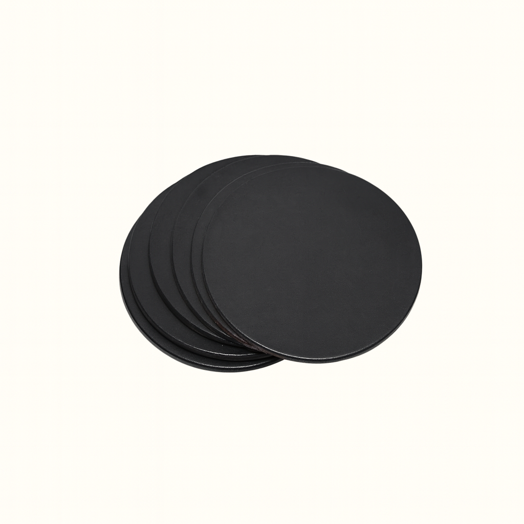Handcrafted natural vegetable-tanned black leather round coaster set by Happy Patina