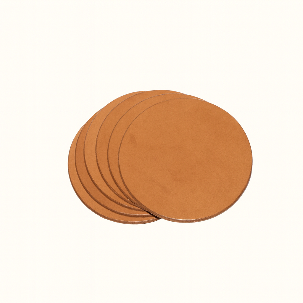 Handcrafted natural vegetable-tanned tan leather round coaster set by Happy Patina