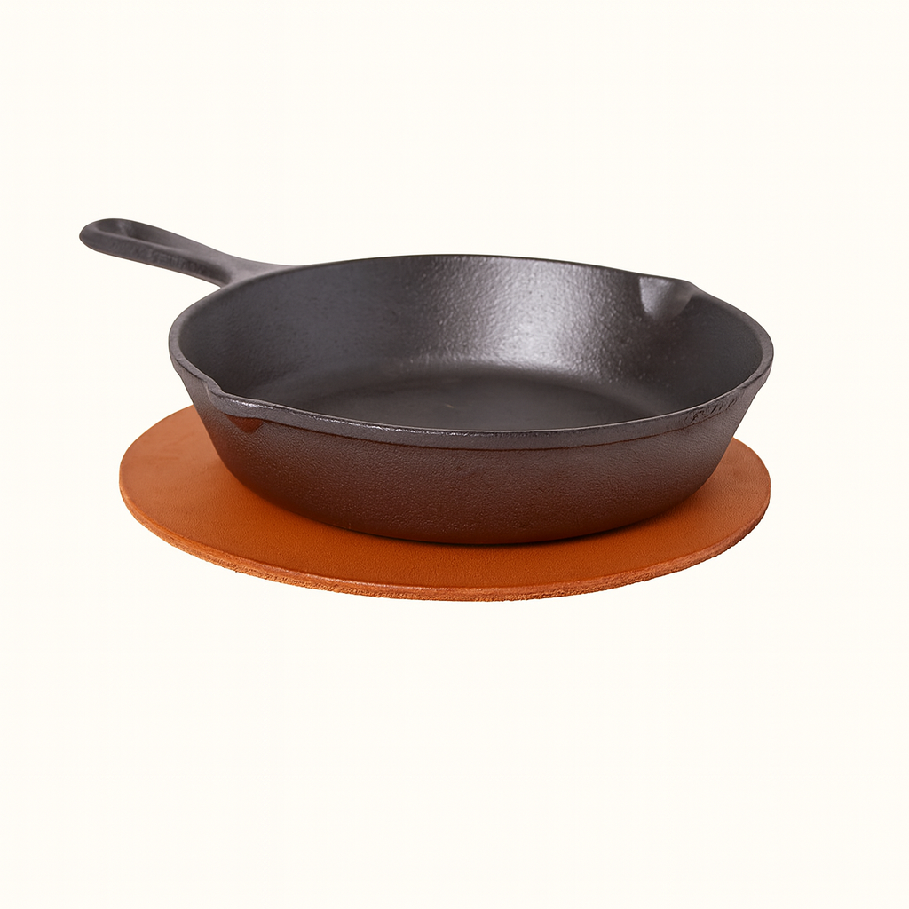 Round leather trivet in natural veg‑tan  brown tanned leather by Happy Patina