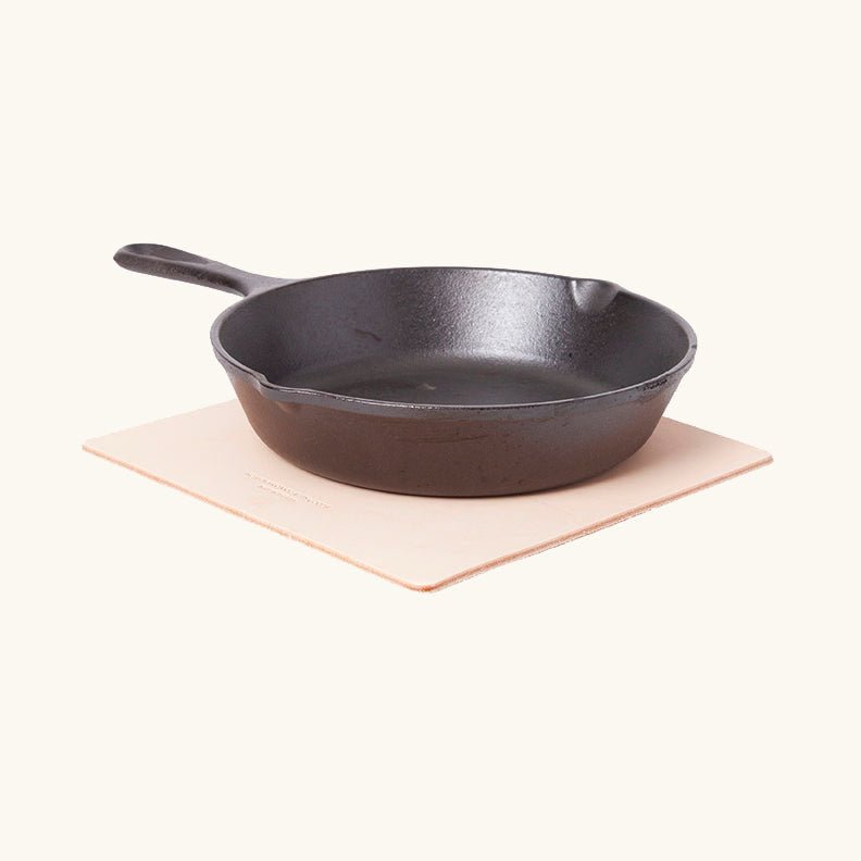 Handcrafted square vegetable‑tanned leather trivet by Happy Patina