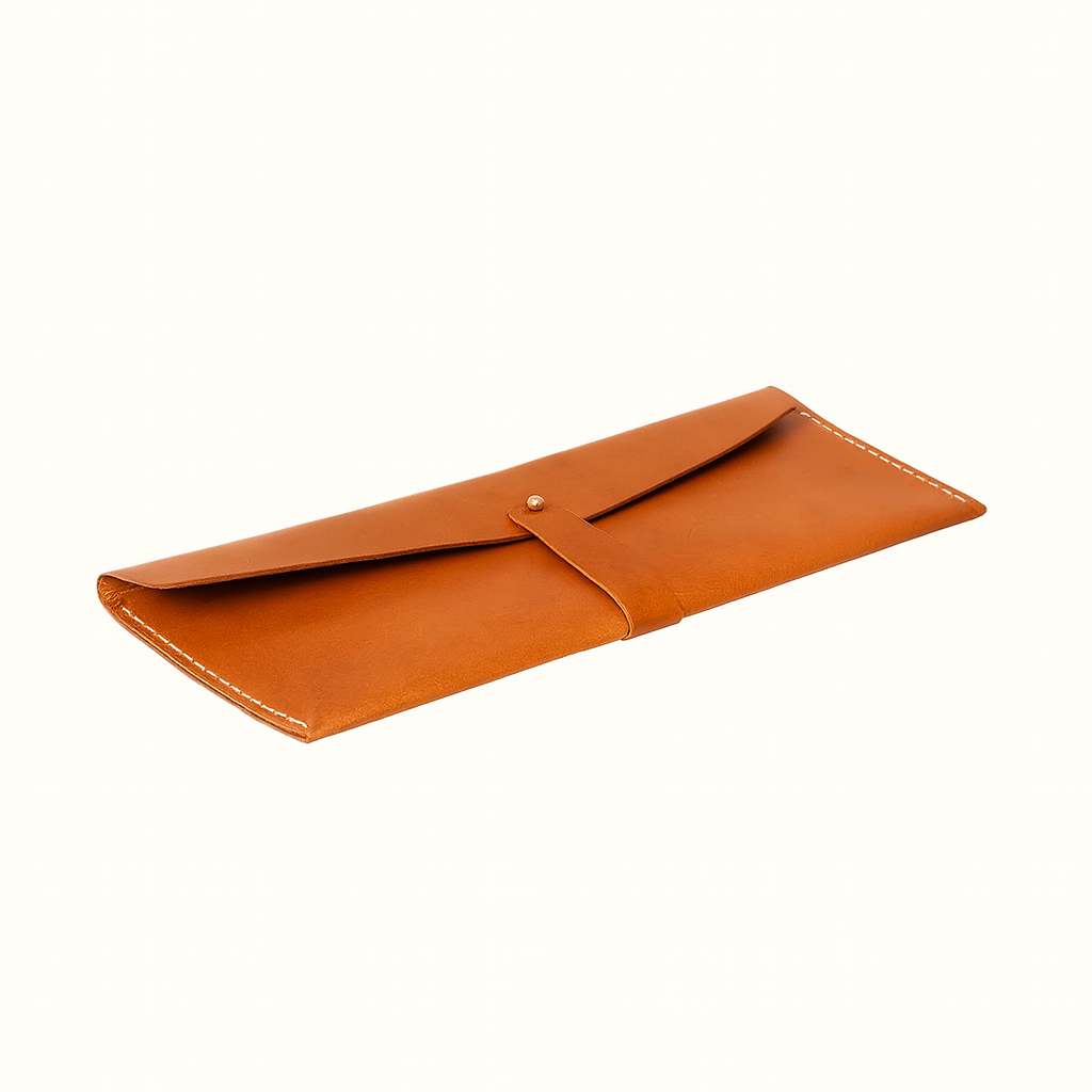 Taylor clutch crafted in natural vegetable-tanned tan leather by Happy Patina