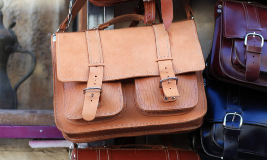 Close-up of vegetable-tanned leather developing natural patina under soft warm light by HappyPatina