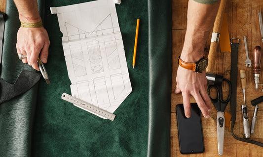 Artisan working with leather and tools representing the craft revival movement by HappyPatina