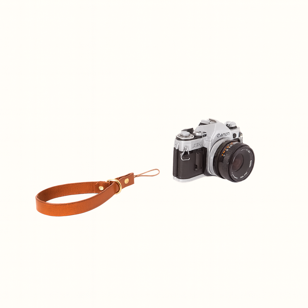 Handcrafted natural veg-tan tanned leather camera wrist strap with brass hardware by Happy Patina