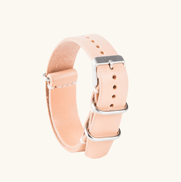 Handcrafted NATO-style watch strap in natural veg-tan leather (20mm). Durable, elegant, and ages beautifully with patina. Made in Spain.