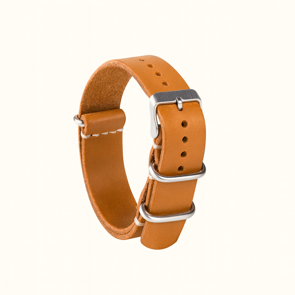 Handcrafted NATO-style watch strap in natural veg-tan tanned leather (20mm). Durable, elegant, and ages beautifully with patina. Made in Spain.