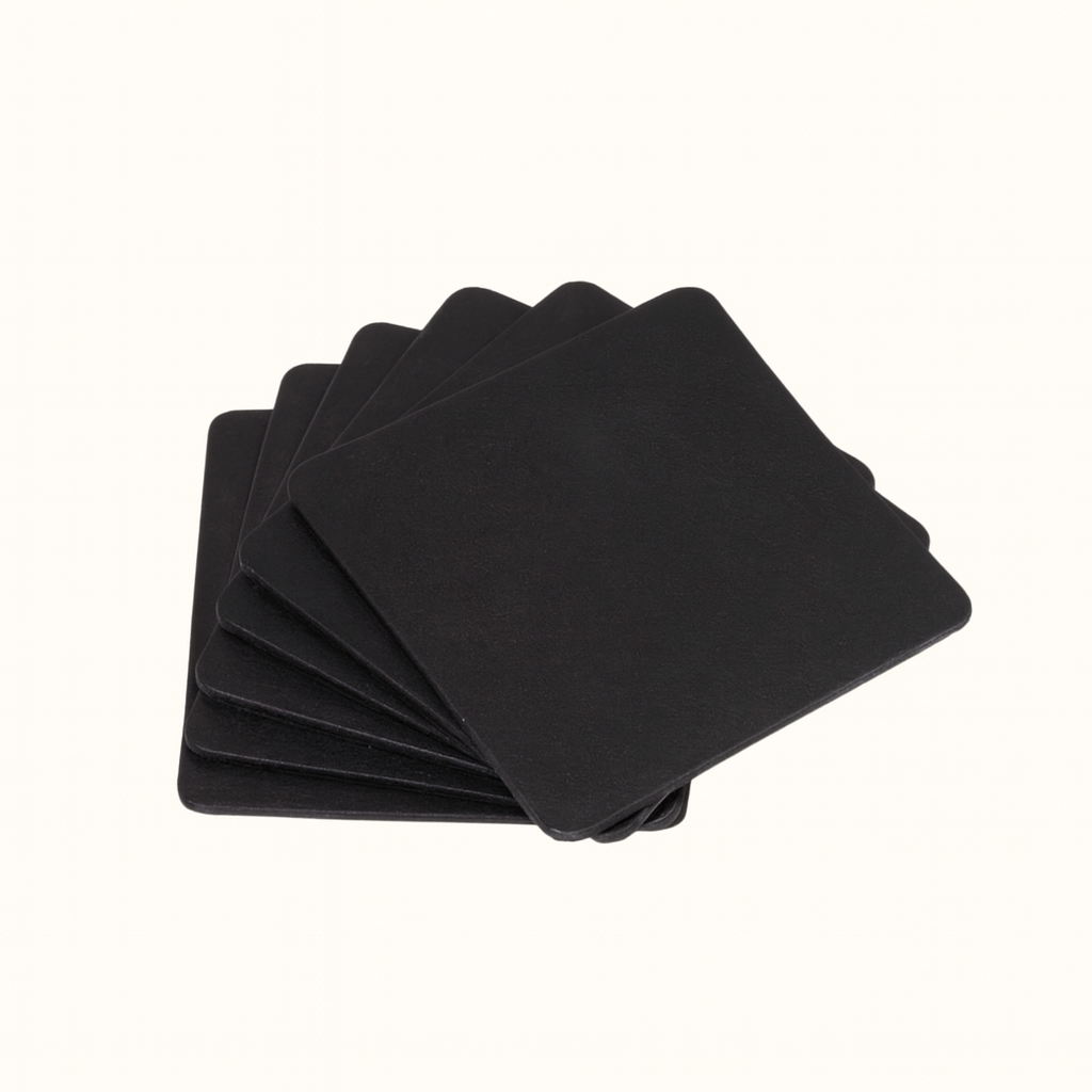 Handcrafted natural vegetable-tanned black leather square coaster set by Happy Patina