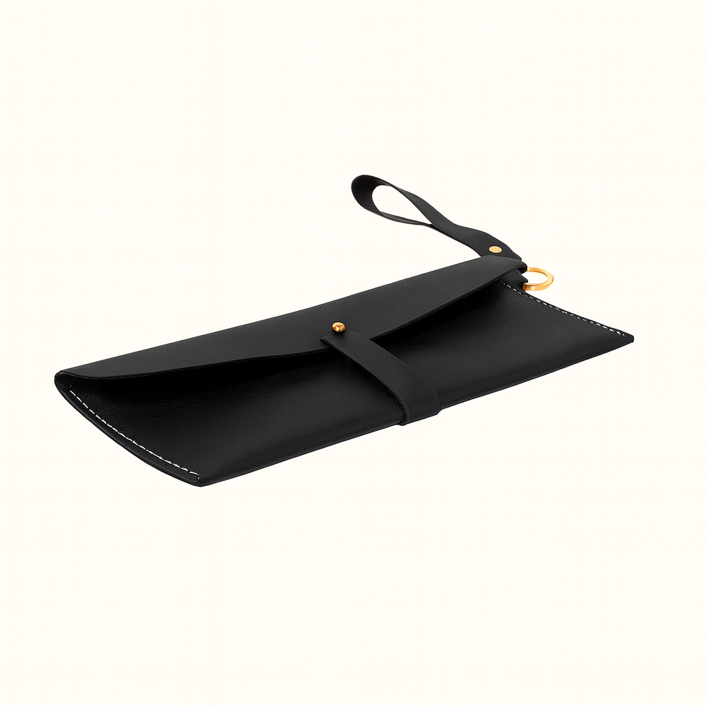 Taylor clutch crafted in natural vegetable-tanned black leather by Happy Patina