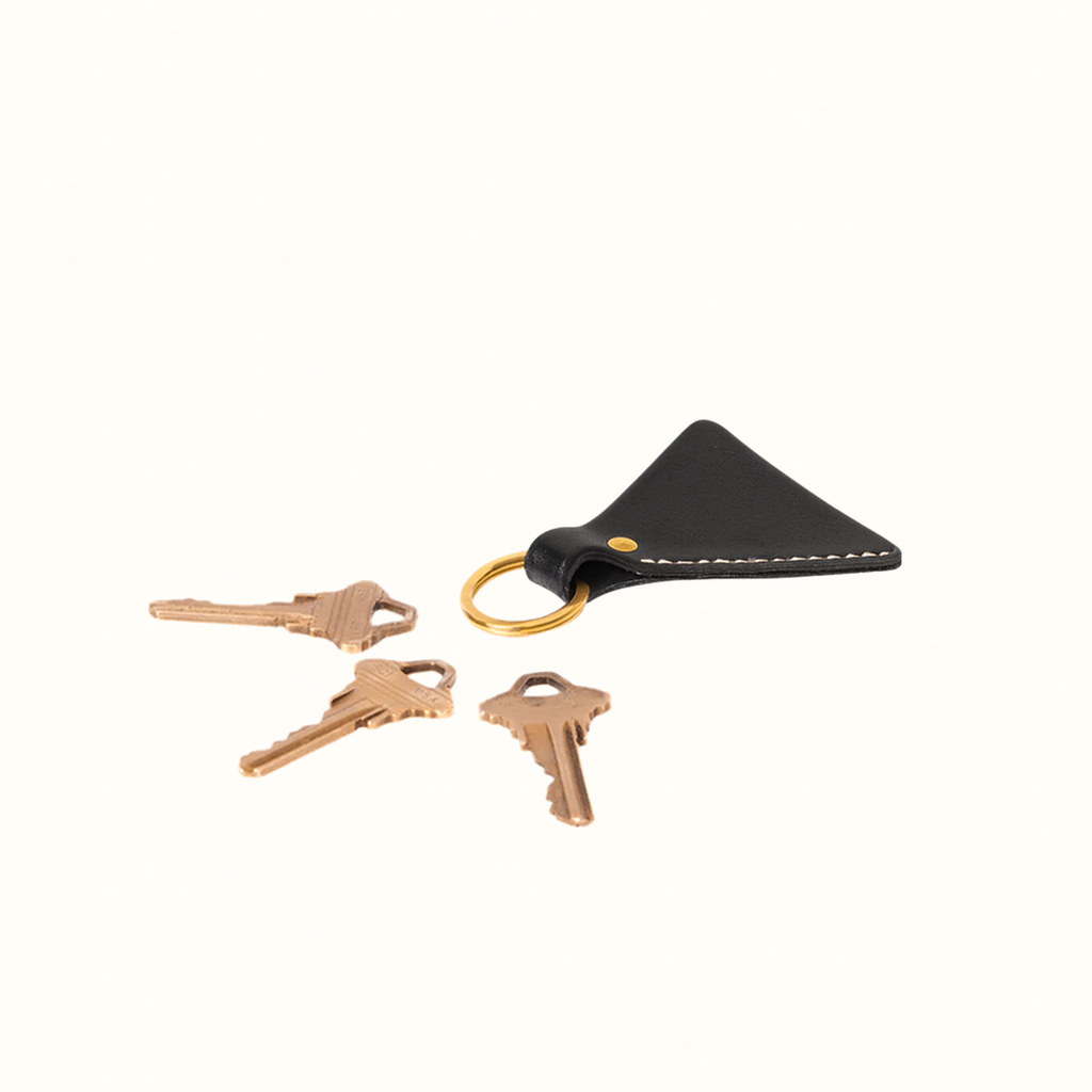 Handcrafted triangular natural veg-tan black leather key fob by Happy Patina