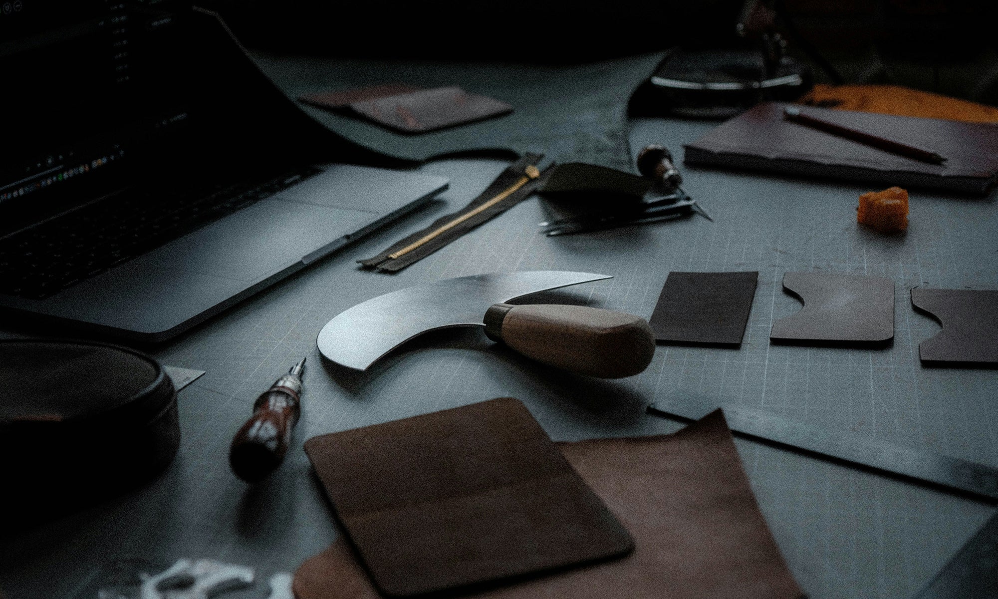 Vegetable-tanned leather and tools in artisan workshop — HappyPatina craftsmanship and design.